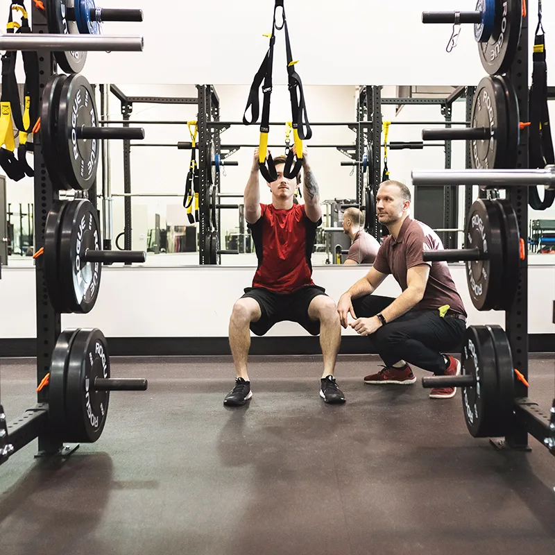 Athlete training at Acceleration Physio Physiotherapist working with an athlete in the gym at Sherwood Park Acceleration Physiotherapy